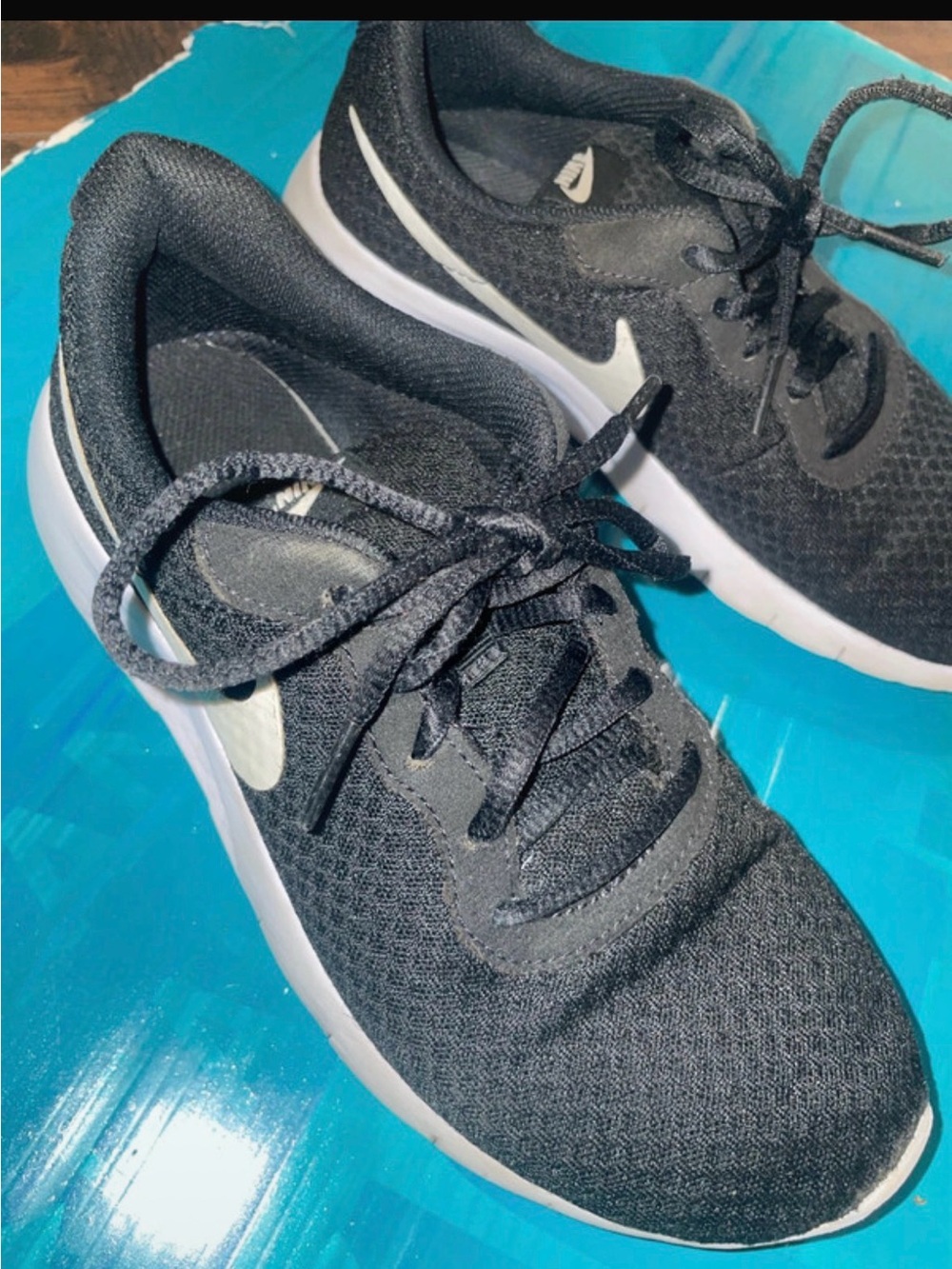 Nike Women’s Black Mesh Running Sneakers with White Swoosh